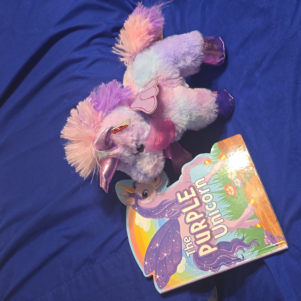 Brand new Unicorn stuffed animal and tge purple Unicorn book